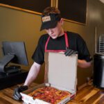 staff boxing pizza, Enzo’s Pizza Co., Johnson City, New York