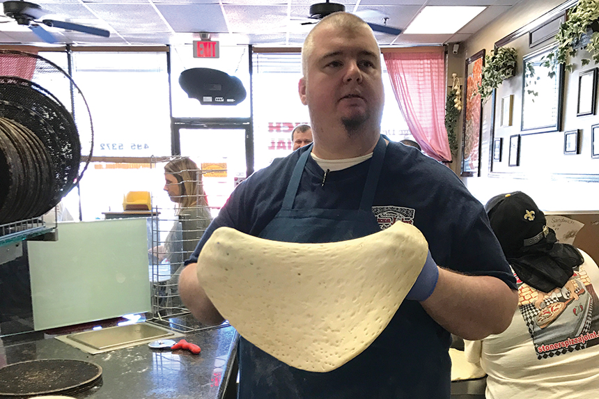 stretching pizza dough